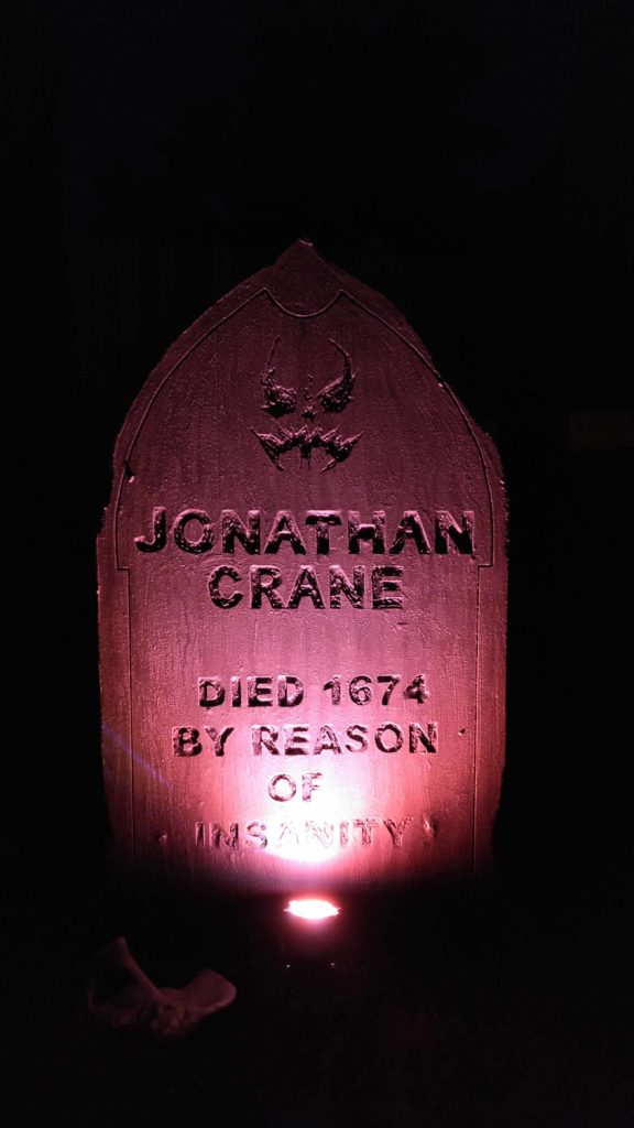 A tombstone with Jonathan Crane in the epitaph. The character from batman.